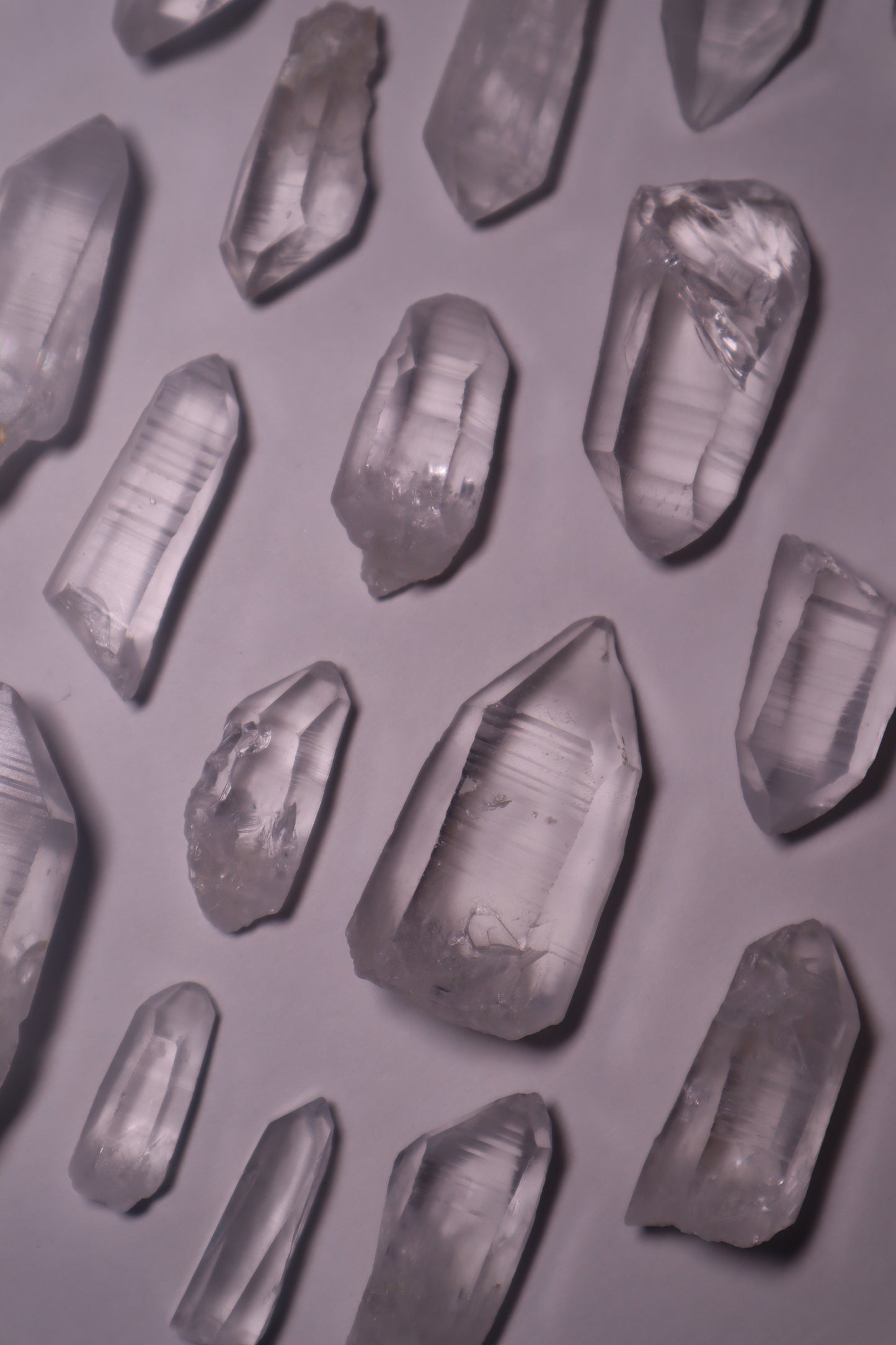 Clear Lemurian Quartz: Extraordinary formations known for their remarkable clarity and distinctive ladder-like striations.
