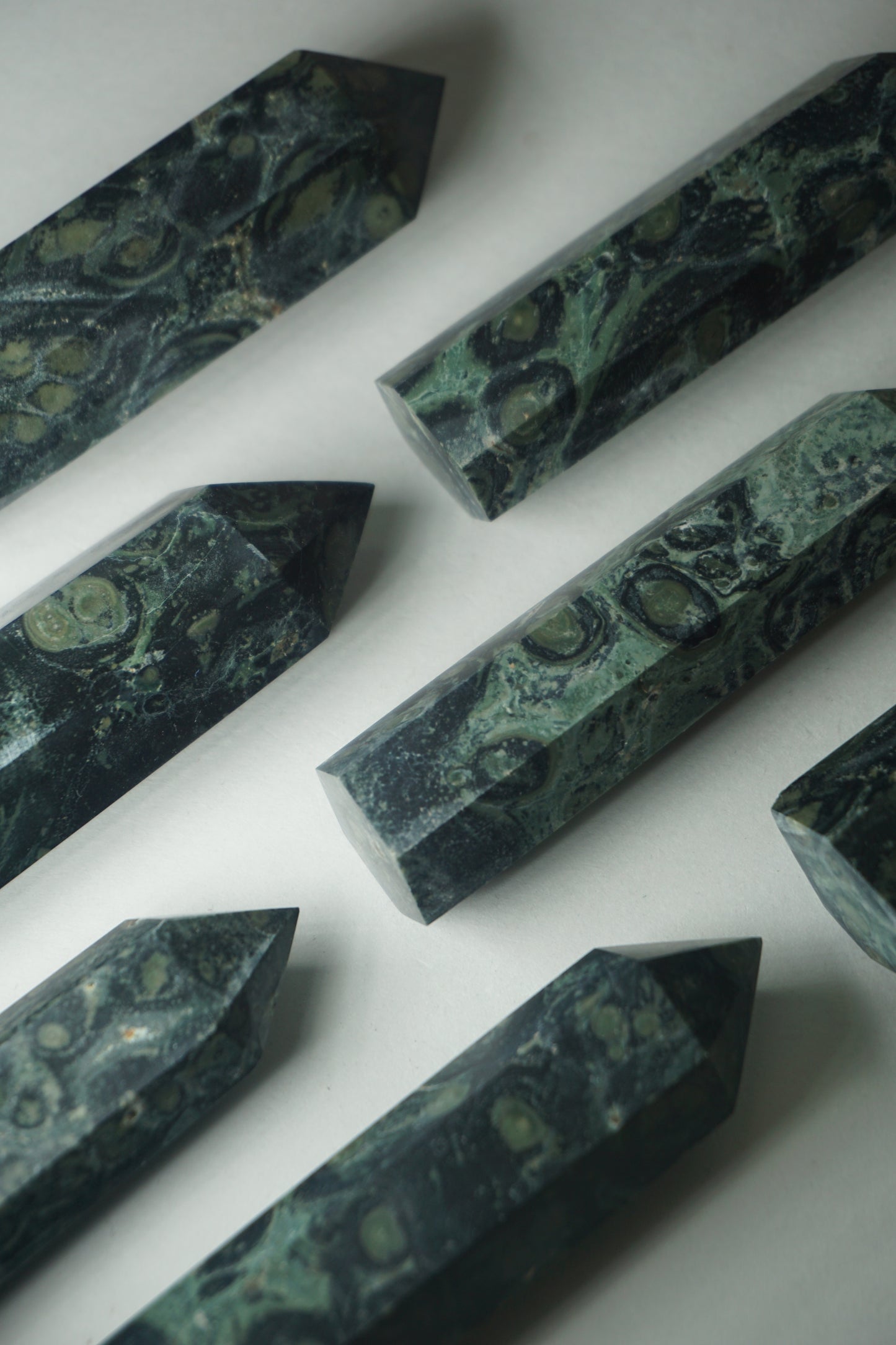 Kambaba Jasper: An intriguing and visually captivating crystal, is cherished for its deep green color and distinct swirling patterns reminiscent of lush landscapes.