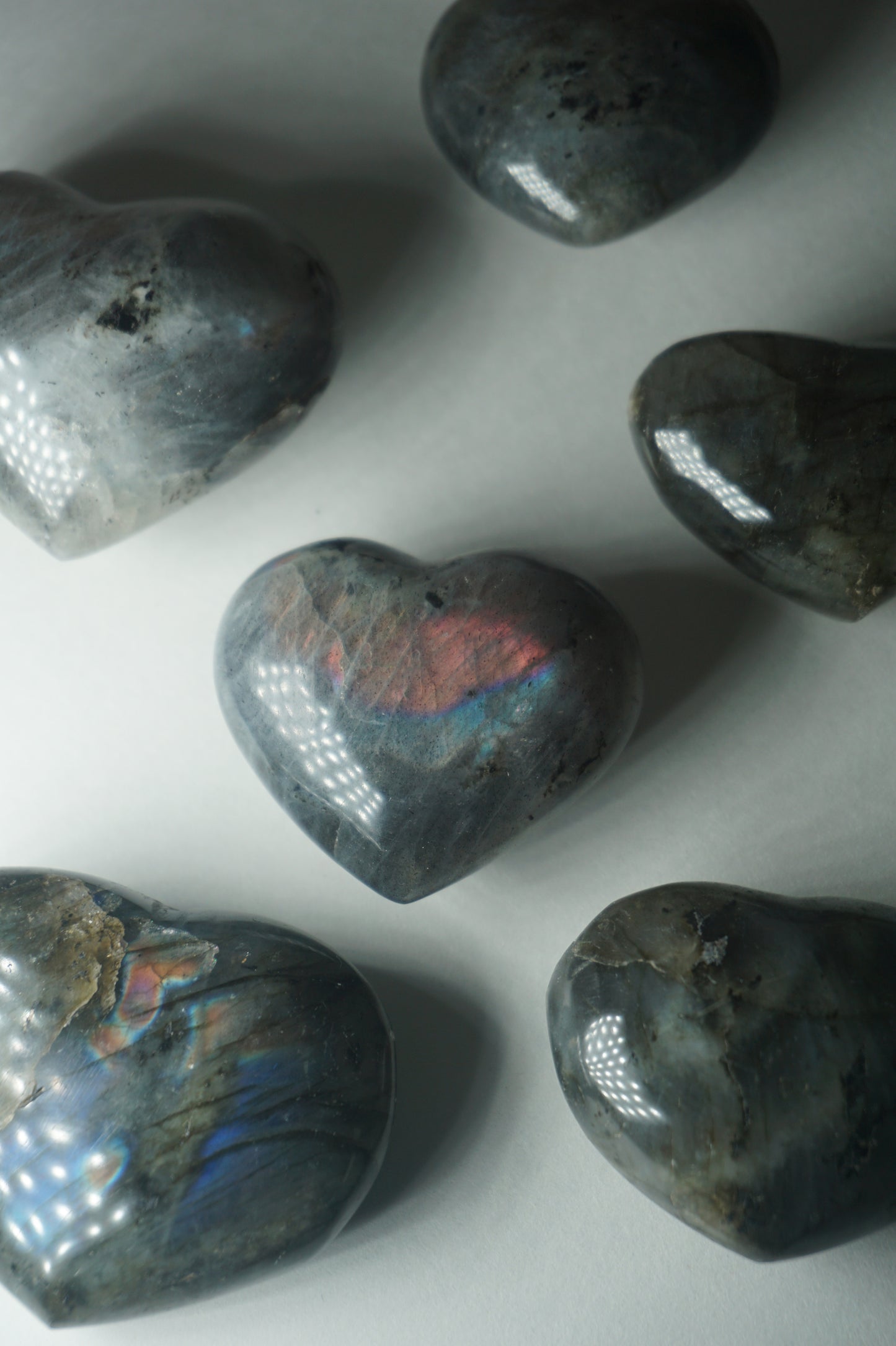 Labradorite: A mesmerizing and iridescent crystal known as the "Stone of Magic," captivates with its play of colors that shift and shimmer when viewed from different angles.
