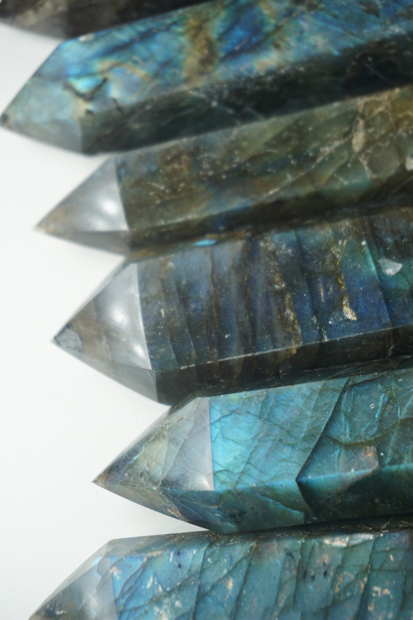 Labradorite: A mesmerizing and iridescent crystal known as the "Stone of Magic," captivates with its play of colors that shift and shimmer when viewed from different angles.