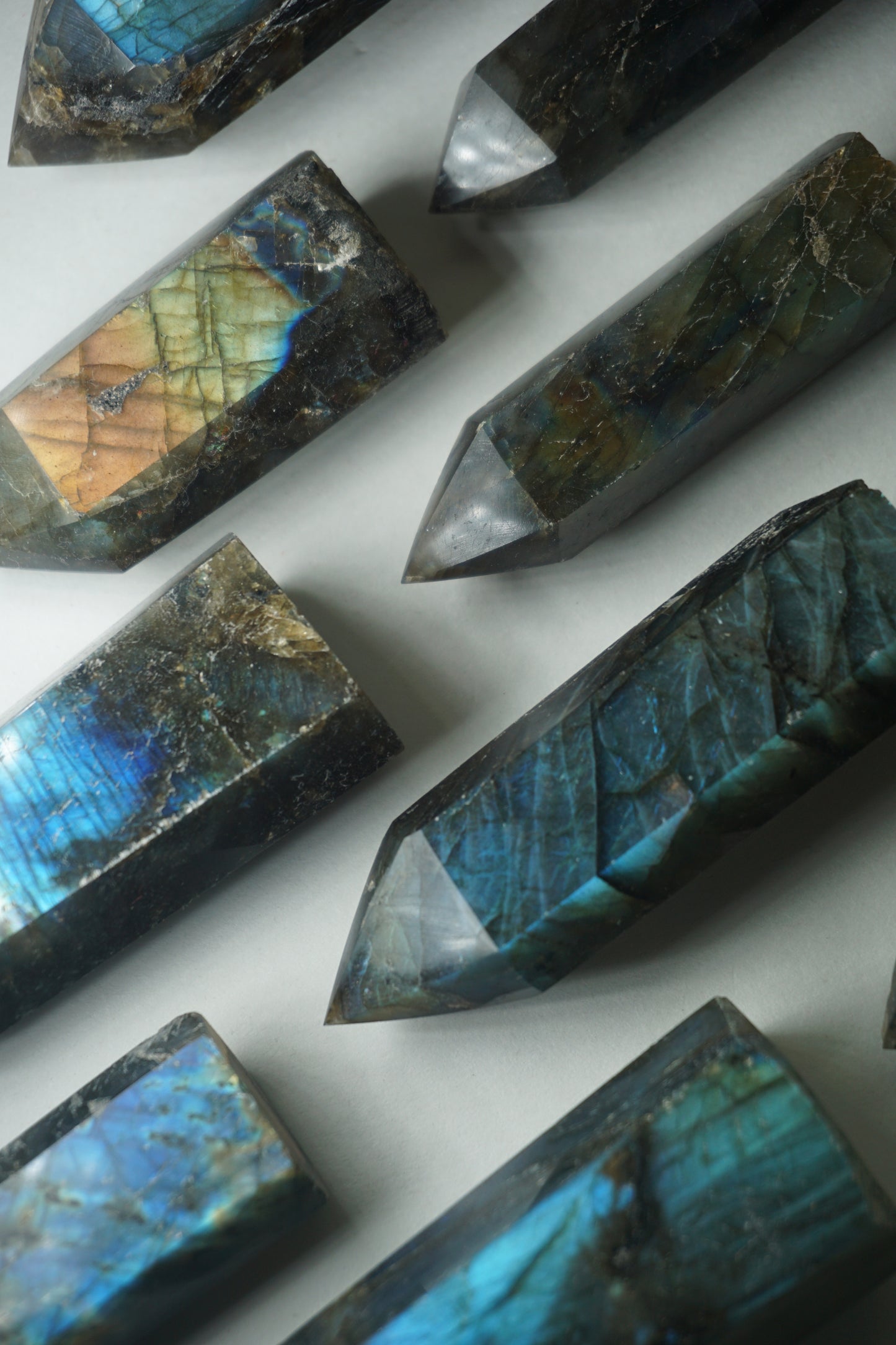 Labradorite: A mesmerizing and iridescent crystal known as the "Stone of Magic," captivates with its play of colors that shift and shimmer when viewed from different angles.