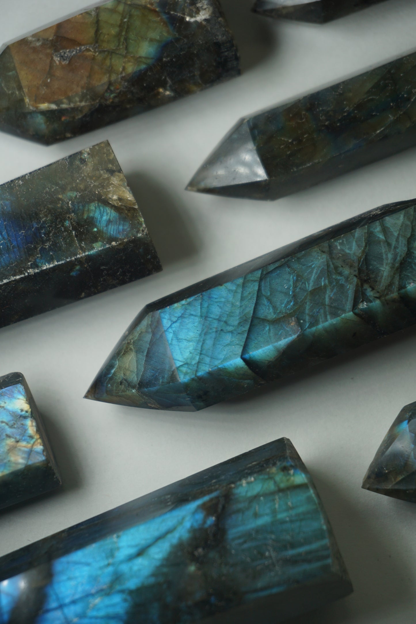 Labradorite: A mesmerizing and iridescent crystal known as the "Stone of Magic," captivates with its play of colors that shift and shimmer when viewed from different angles.
