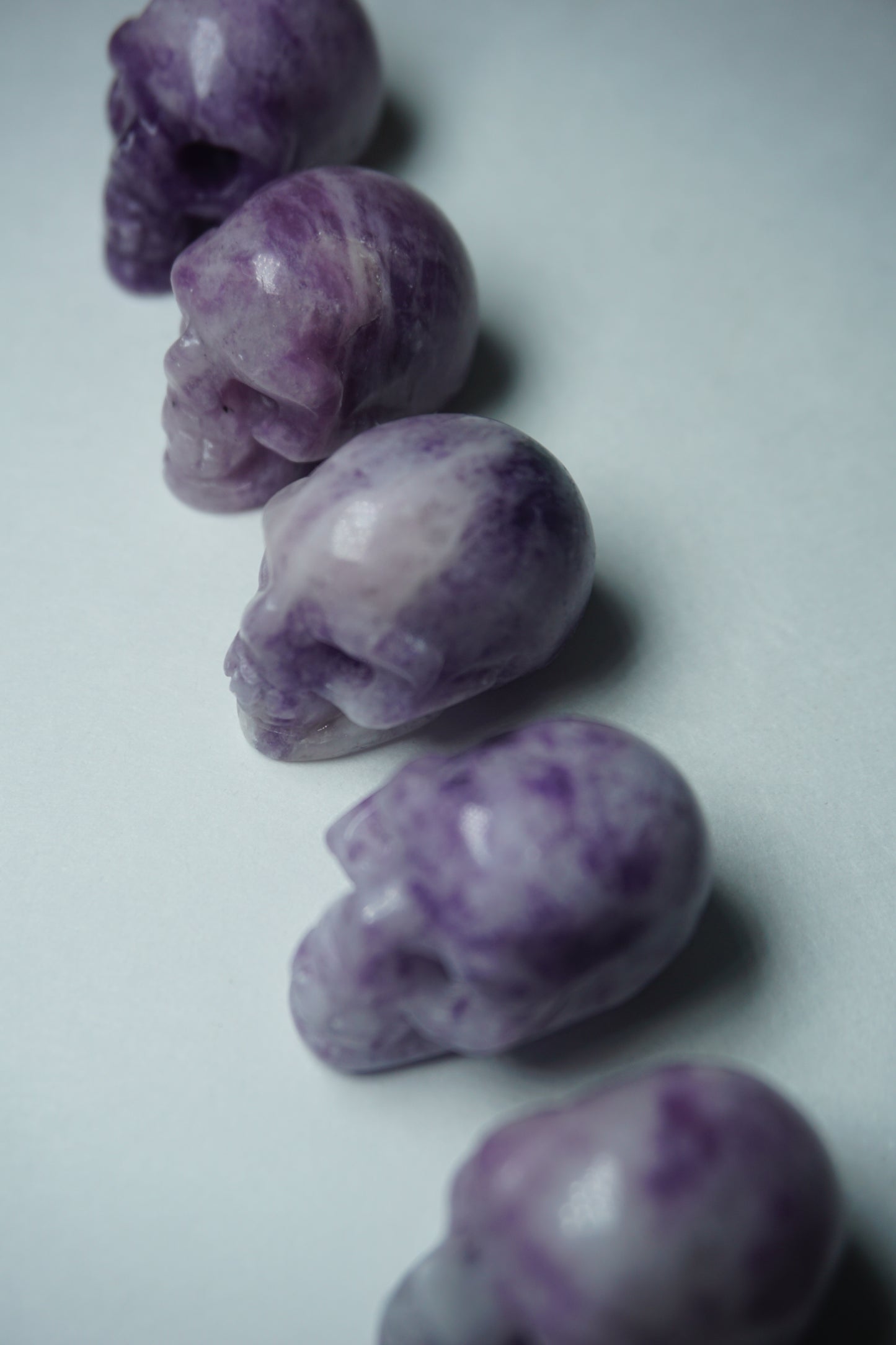 Lepidolite: A serene and calming crystal, is prized for its soft shades of purple and its potent connection to emotional healing and balance. With its association to the Heart, Third Eye, and Crown chakras, Lepidolite promotes inner peace, emotional release, and spiritual insight.