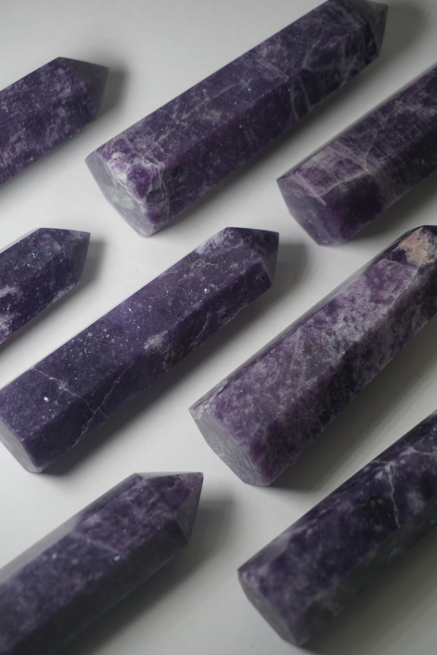 Lepidolite: A serene and calming crystal, is prized for its soft shades of purple and its potent connection to emotional healing and balance. With its association to the Heart, Third Eye, and Crown chakras, Lepidolite promotes inner peace, emotional release, and spiritual insight.
