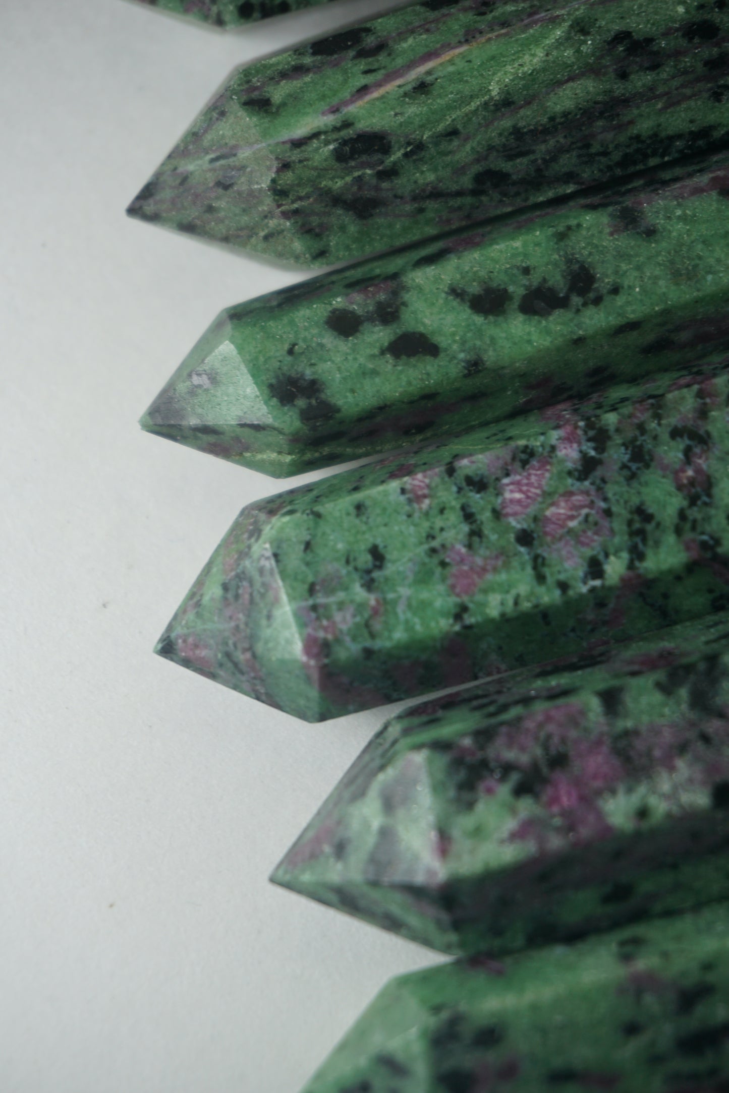 Ruby in Zoisite: Also known as Anyolite, is a captivating crystal that combines the vibrant energy of Ruby with the earthy tones of Zoisite. This unique blend creates a harmonious synergy that is believed to enhance passion, vitality, and spiritual growth.