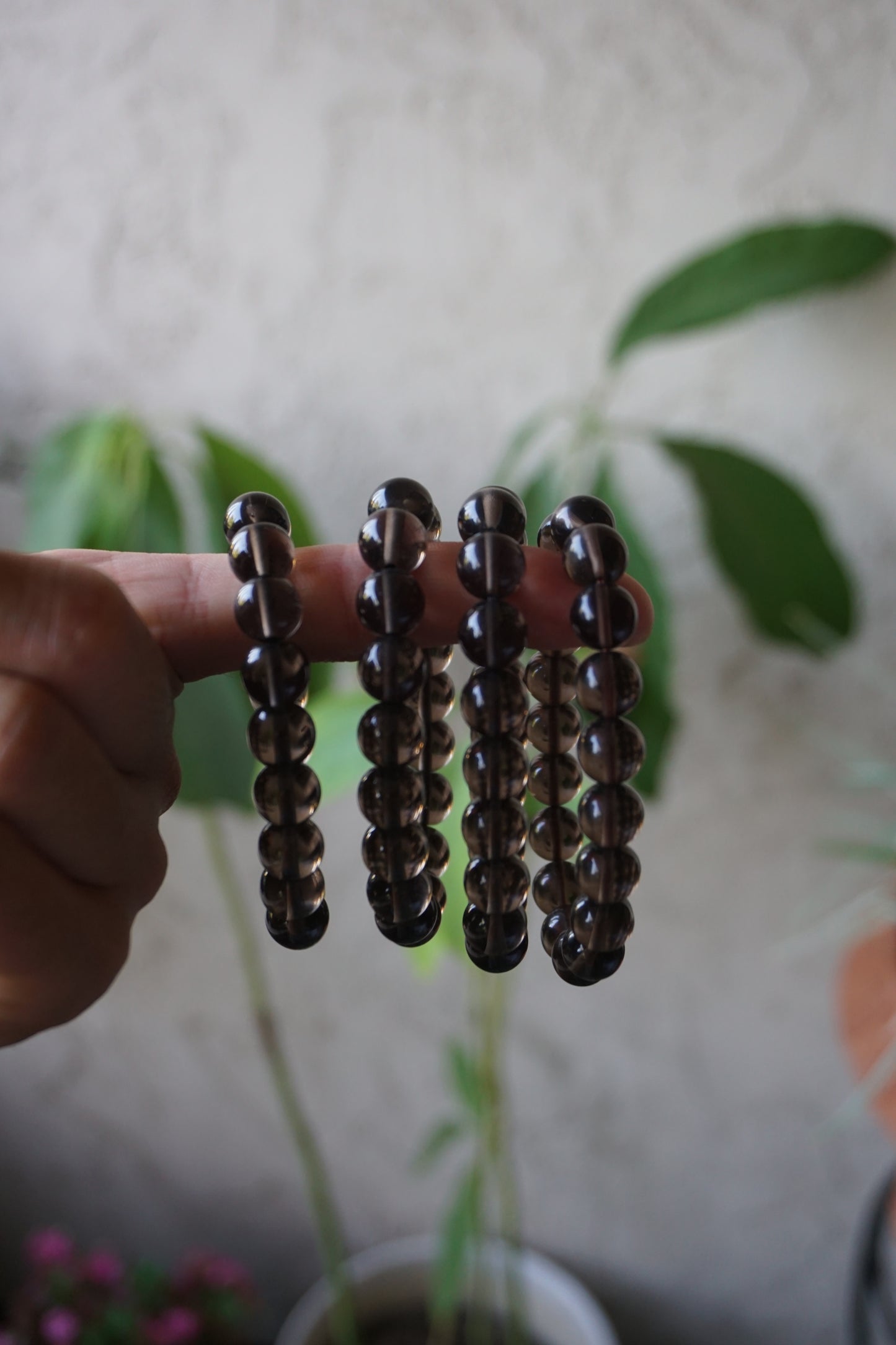 Smoky Quartz: A rich and earthy crystal, is treasured for its smoky brown to black hues that evoke a deep sense of grounding and protection.