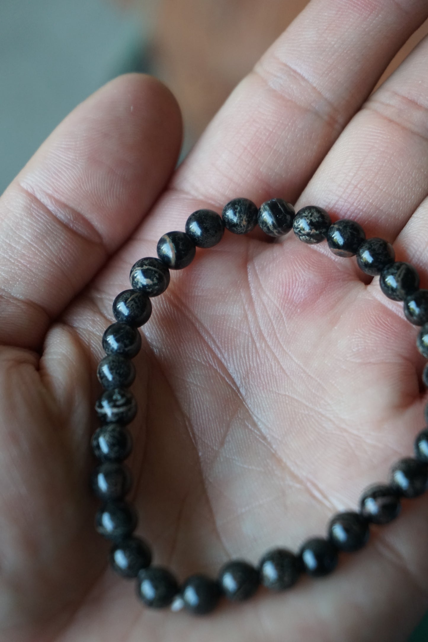Snowflake Obsidian: A unique and mesmerizing crystal, is cherished for its black base color adorned with delicate white "snowflake" patterns. With its grounding and protective energy, Snowflake Obsidian is believed to promote inner balance, emotional healing, and a sense of security.