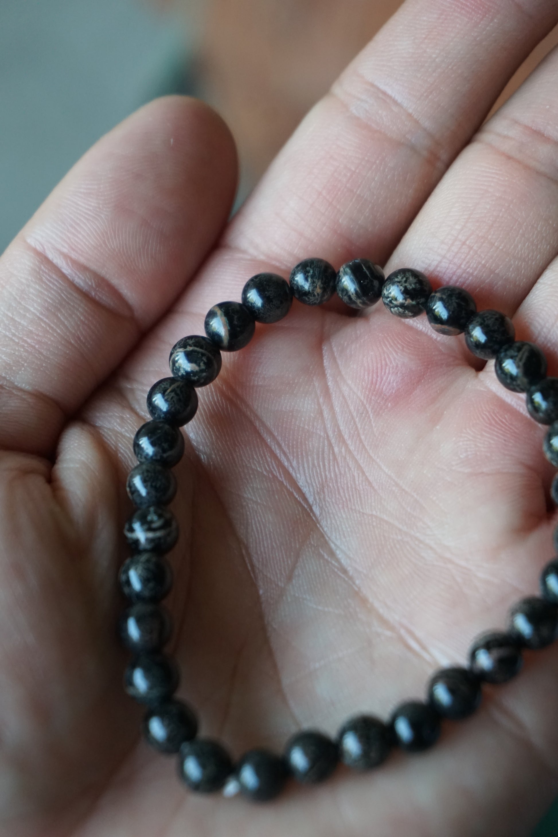 Snowflake Obsidian: A unique and mesmerizing crystal, is cherished for its black base color adorned with delicate white "snowflake" patterns. With its grounding and protective energy, Snowflake Obsidian is believed to promote inner balance, emotional healing, and a sense of security.