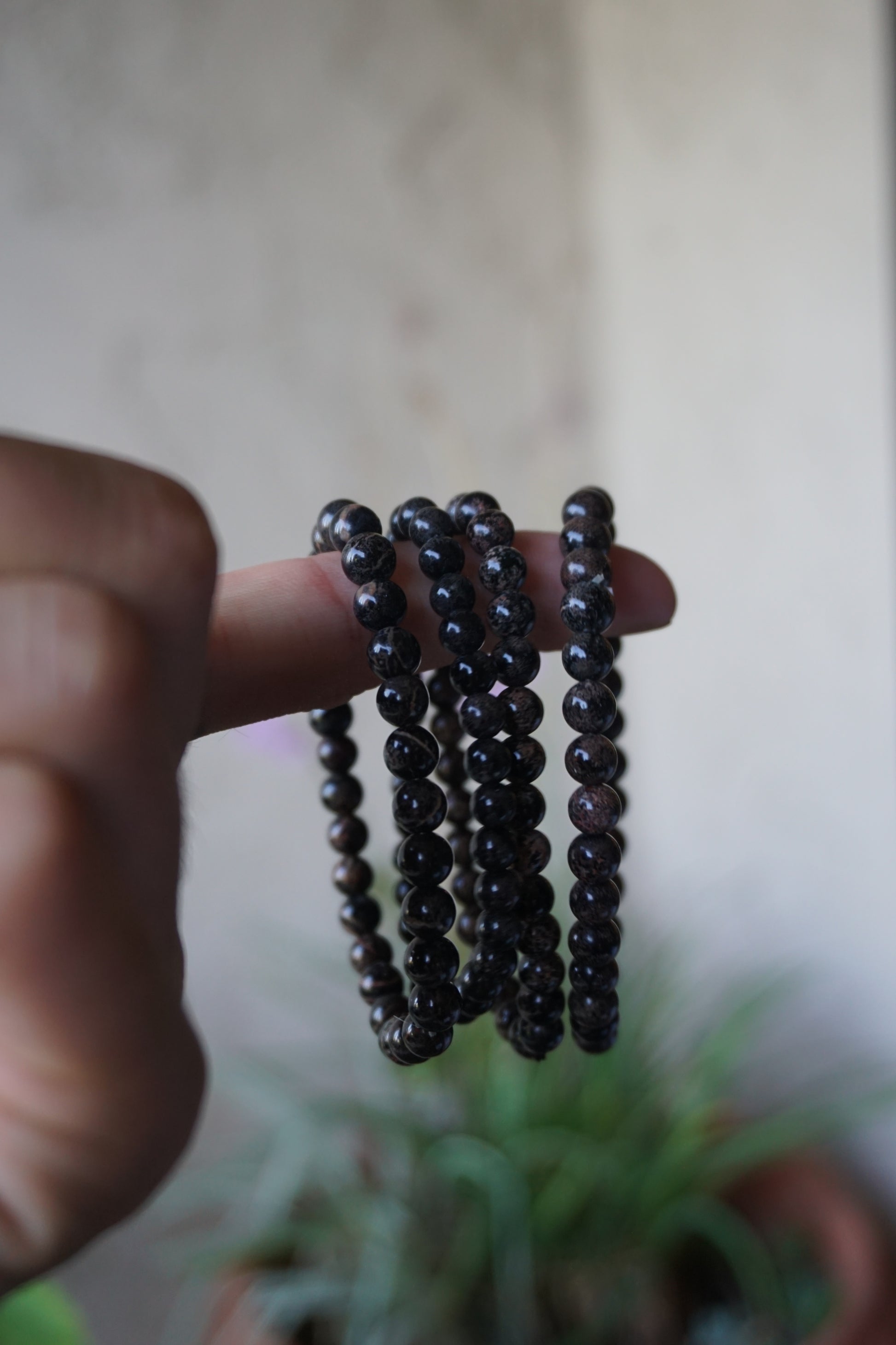 Snowflake Obsidian: A unique and mesmerizing crystal, is cherished for its black base color adorned with delicate white "snowflake" patterns. With its grounding and protective energy, Snowflake Obsidian is believed to promote inner balance, emotional healing, and a sense of security.
