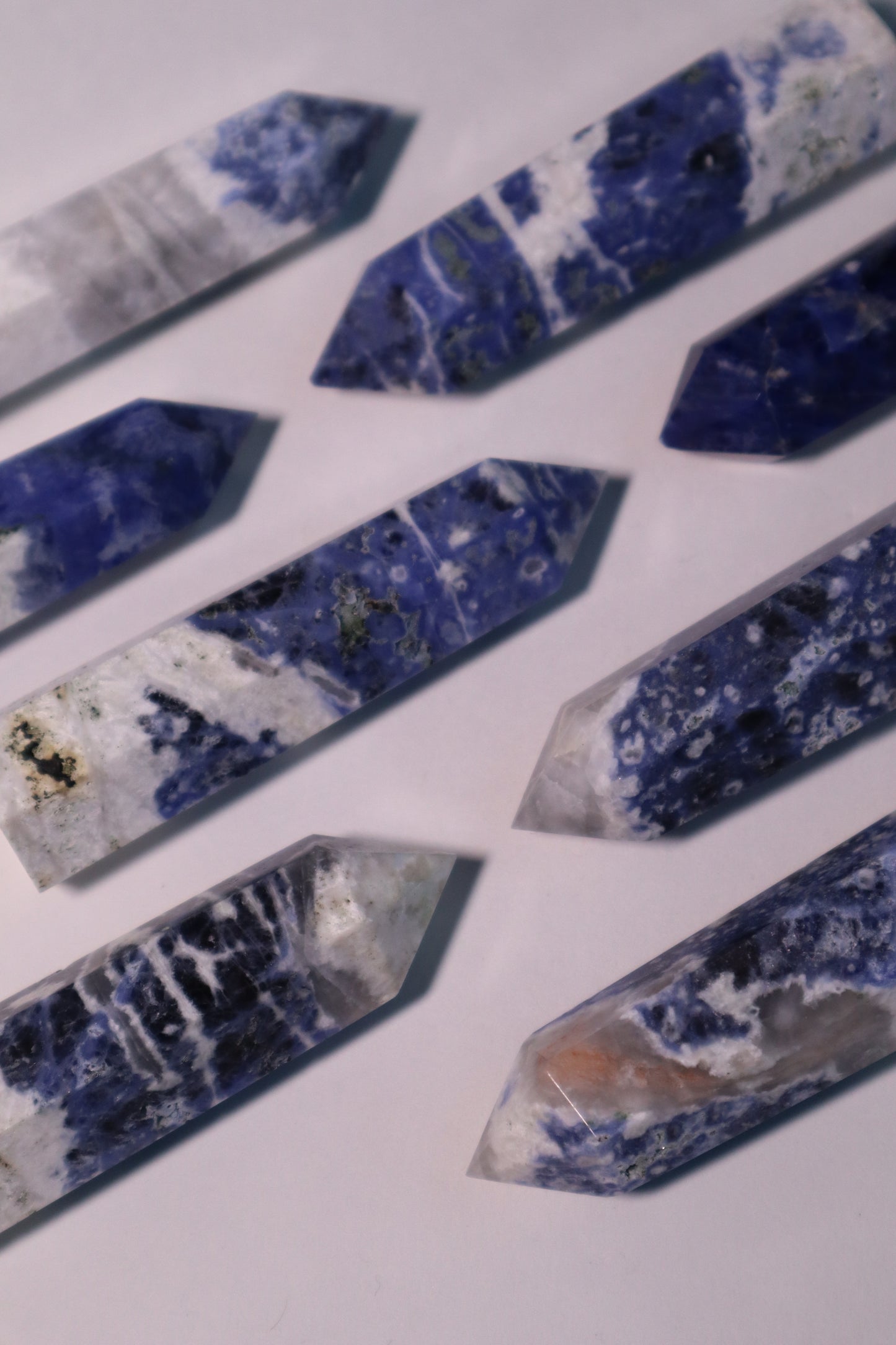 Sodalite: A captivating deep blue crystal mottled with white veins, is esteemed for its harmonizing properties that bridge the gap between logic and intuition. With its serene and calming energy, Sodalite is believed to enhance mental clarity, promoting rational thought and aiding in effective communication.