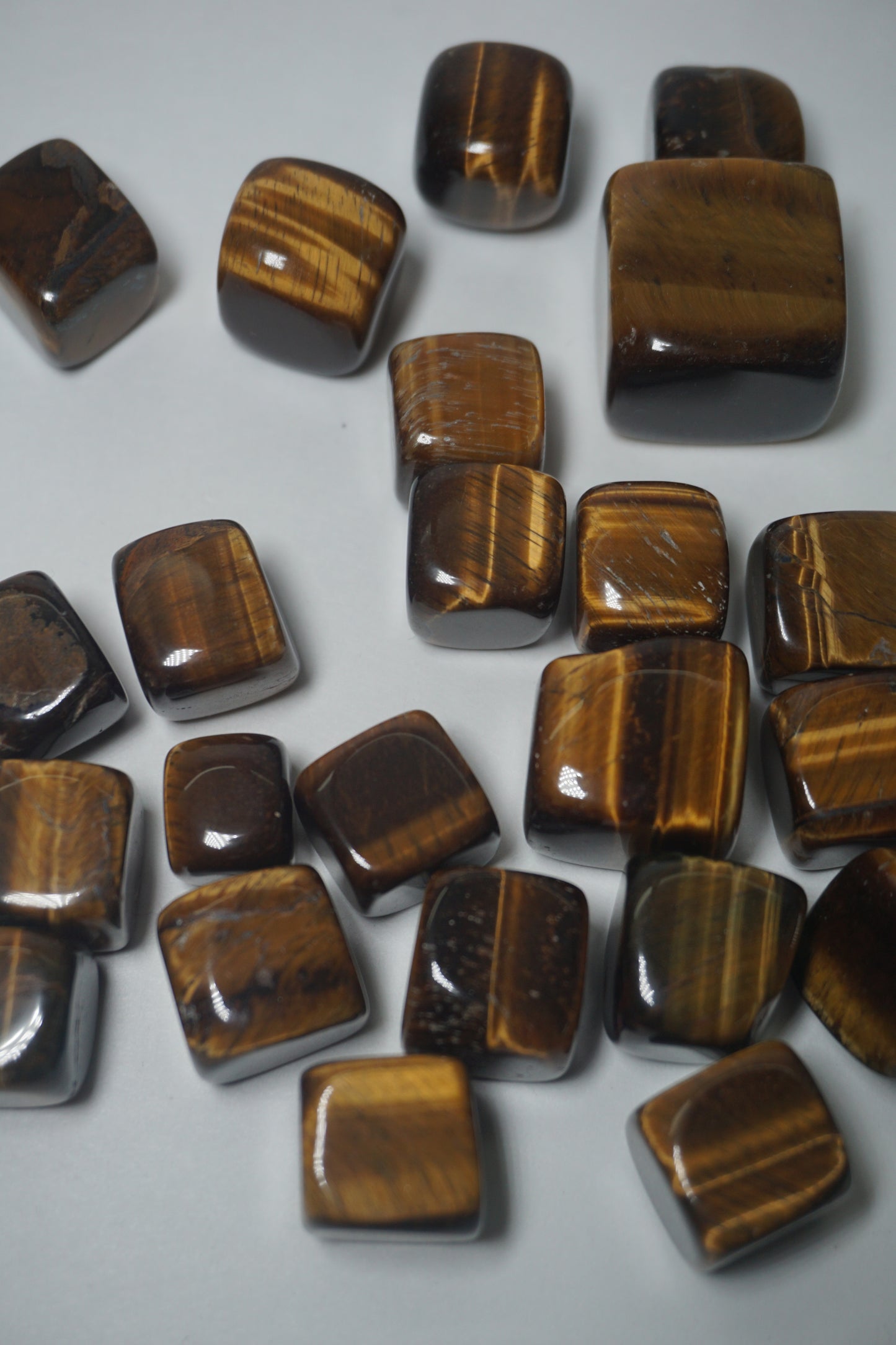 Tiger's Eye: Well-known for its grounding and protecting characteristics. It is thought to repel bad energy, boost self-confidence, and promote mental clarity. It is also utilized to attract wealth and success.