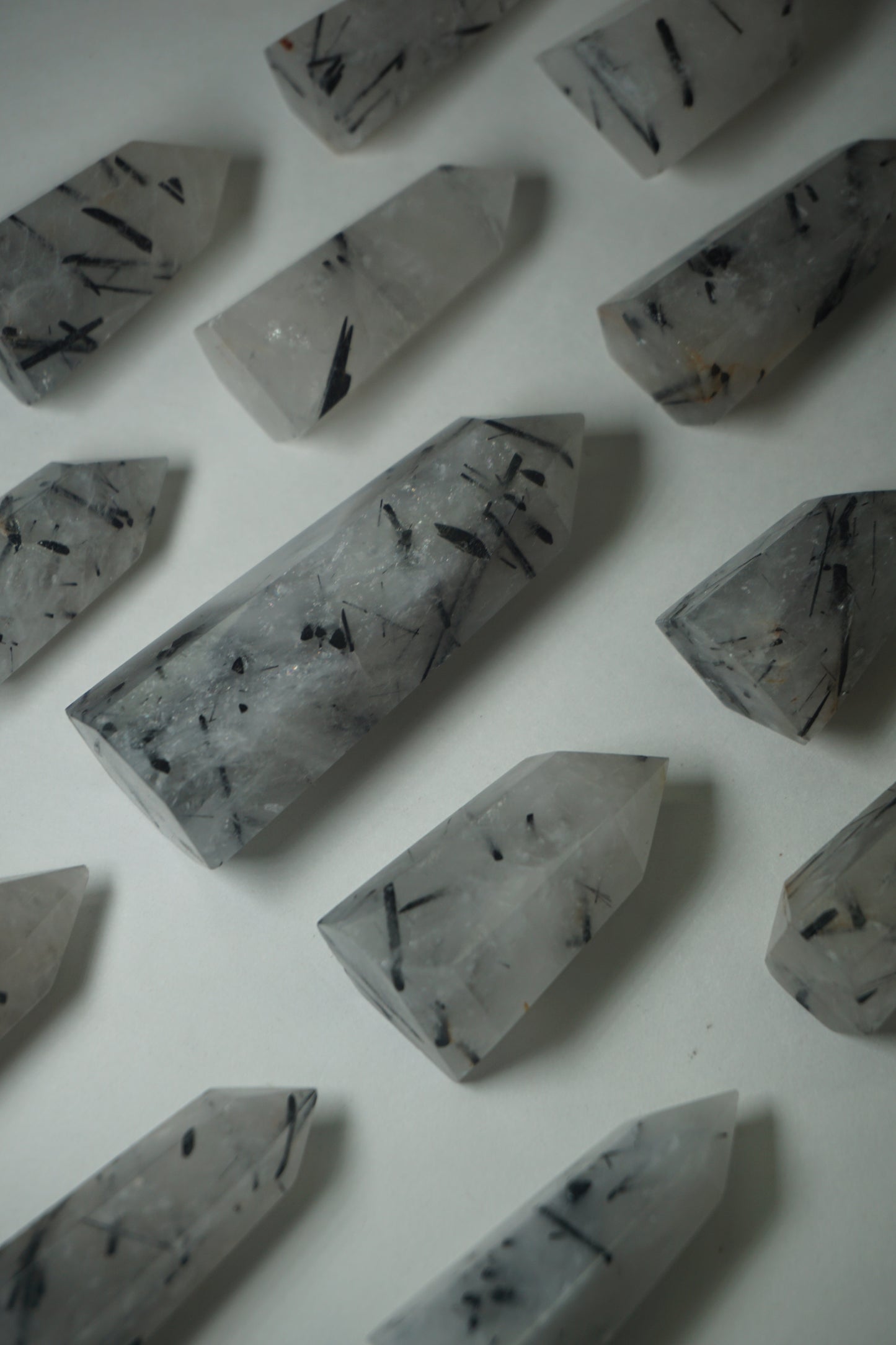 Rutile Quartz: A mesmerizing crystal characterized by golden or reddish-brown needle-like inclusions, is cherished for its powerful energetic properties.