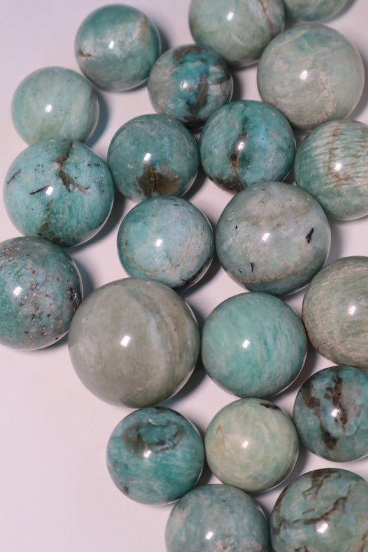 Amazonite: A captivating and soothing crystal, is celebrated for its tranquil shades of blue-green reminiscent of calming waters.