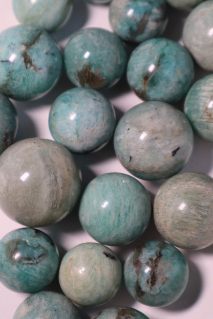 Amazonite: A captivating and soothing crystal, is celebrated for its tranquil shades of blue-green reminiscent of calming waters.