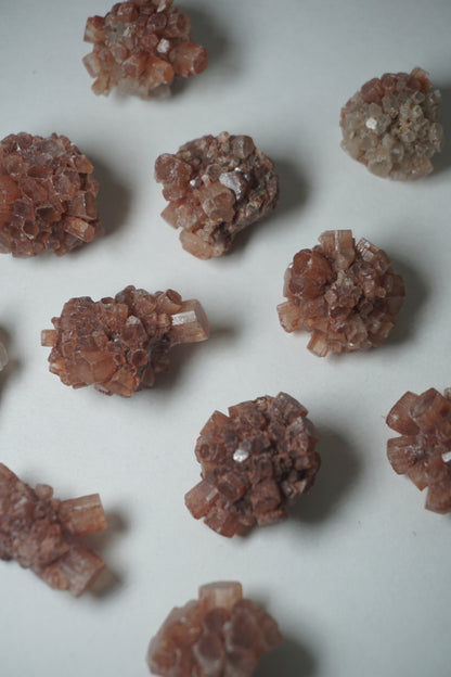Aragonite Sputnik: A unique and captivating crystal formation, showcases a mesmerizing array of delicate radiating crystals that resemble the shape of a sputnik satellite.