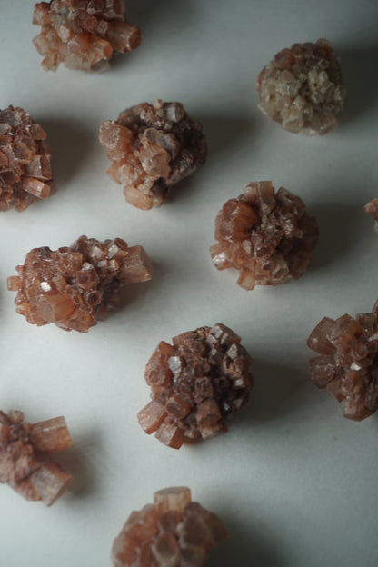 Aragonite Sputnik: A unique and captivating crystal formation, showcases a mesmerizing array of delicate radiating crystals that resemble the shape of a sputnik satellite.