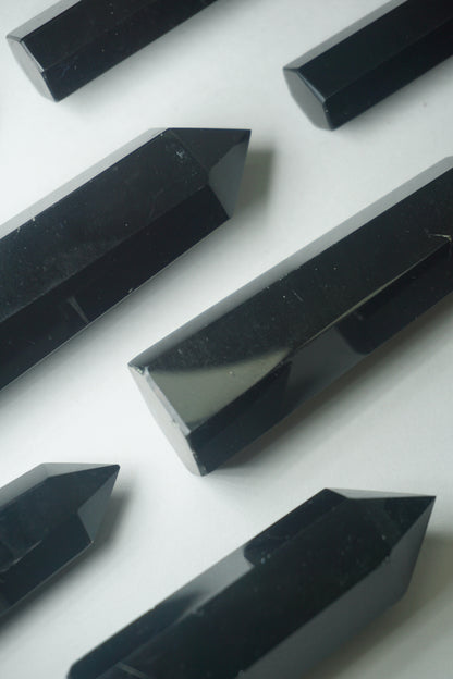 Black Obsidian: A potent and grounding crystal, is revered for its intense protective properties and transformative energy.