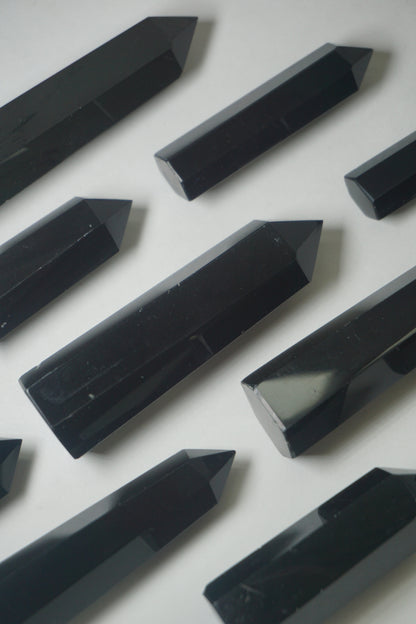 Black Obsidian: A potent and grounding crystal, is revered for its intense protective properties and transformative energy.