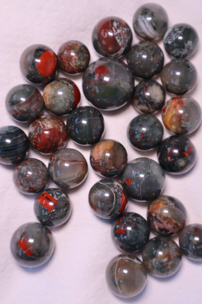 Bloodstone: A captivating green and red speckled crystal, is renowned for its powerful healing properties.