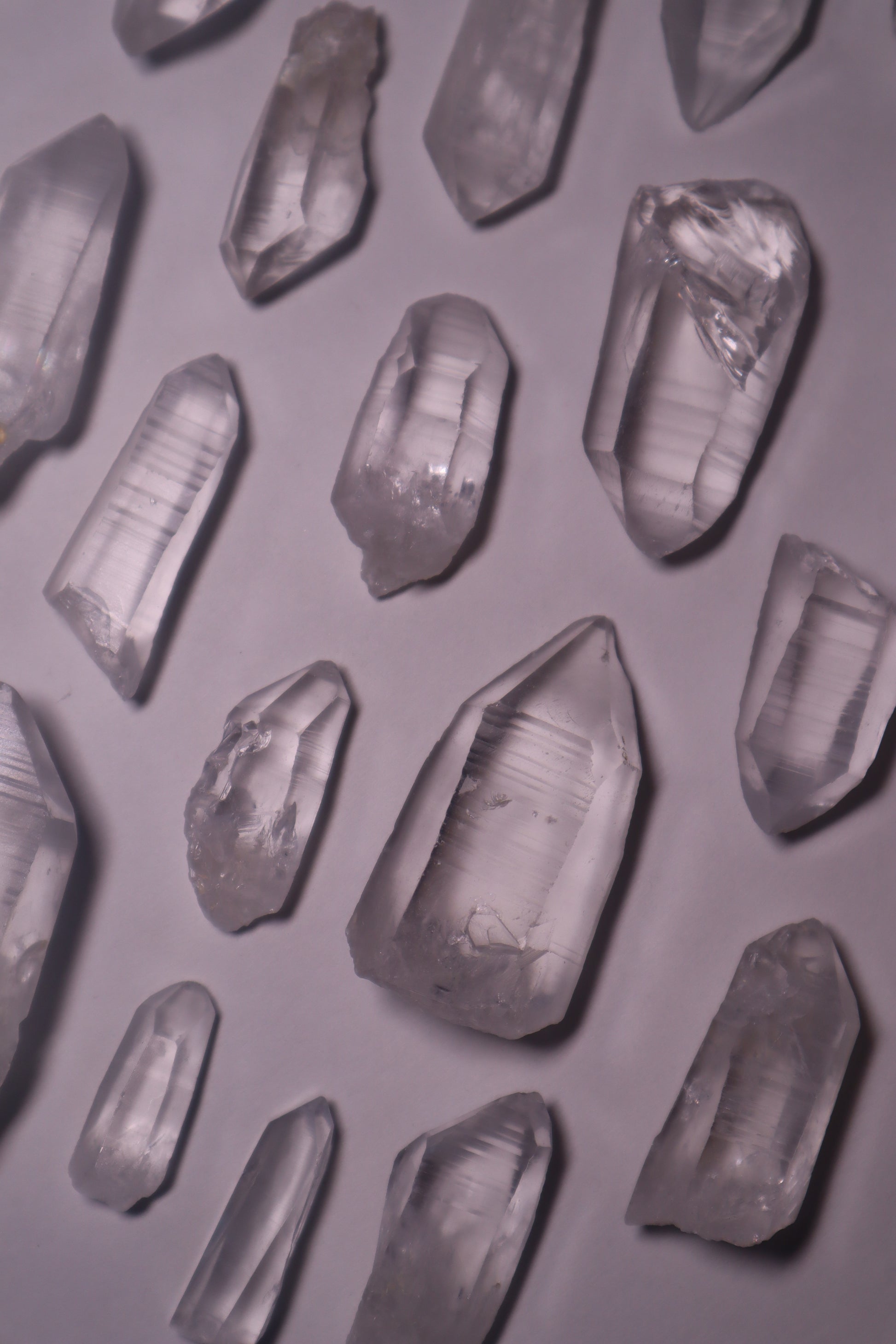 Clear Lemurian Quartz: Extraordinary formations known for their remarkable clarity and distinctive ladder-like striations.