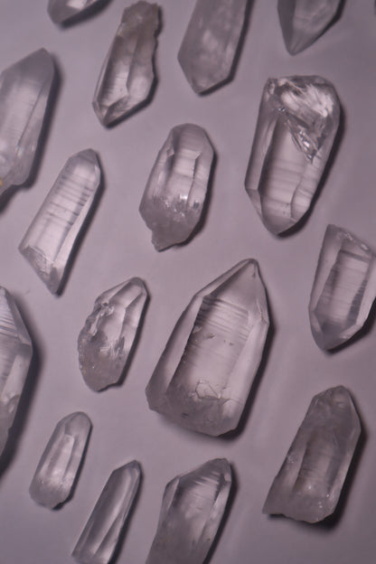 Clear Lemurian Quartz: Extraordinary formations known for their remarkable clarity and distinctive ladder-like striations.