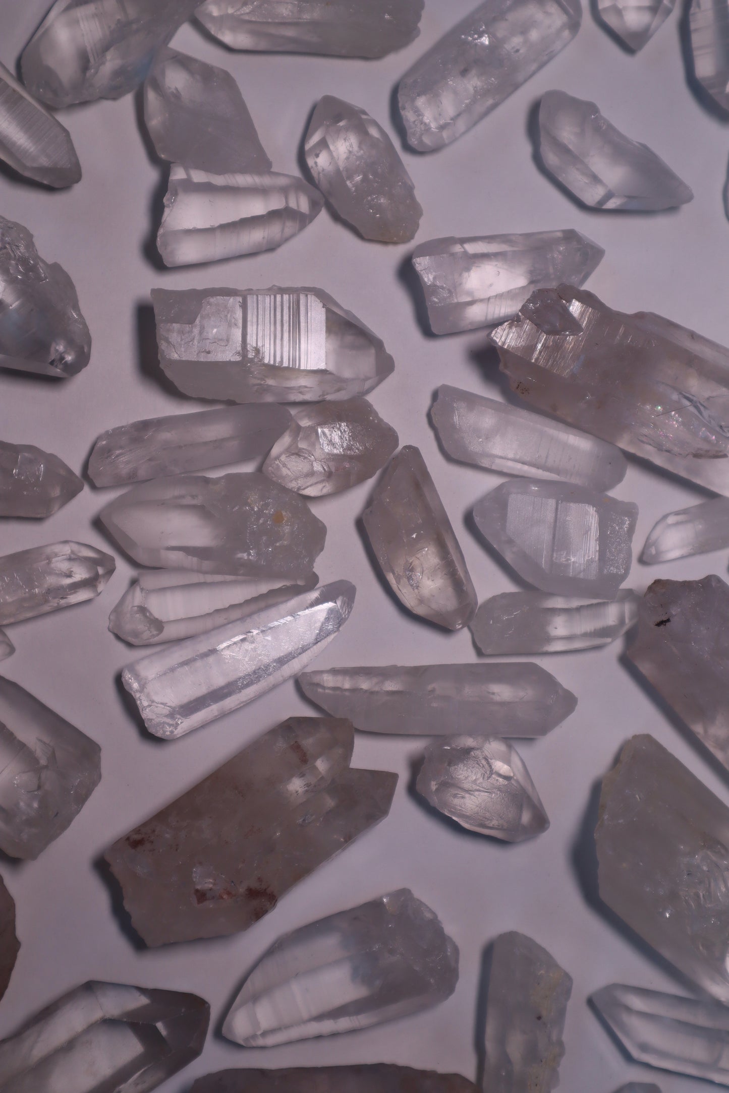 Clear Lemurian Quartz: Extraordinary formations known for their remarkable clarity and distinctive ladder-like striations.