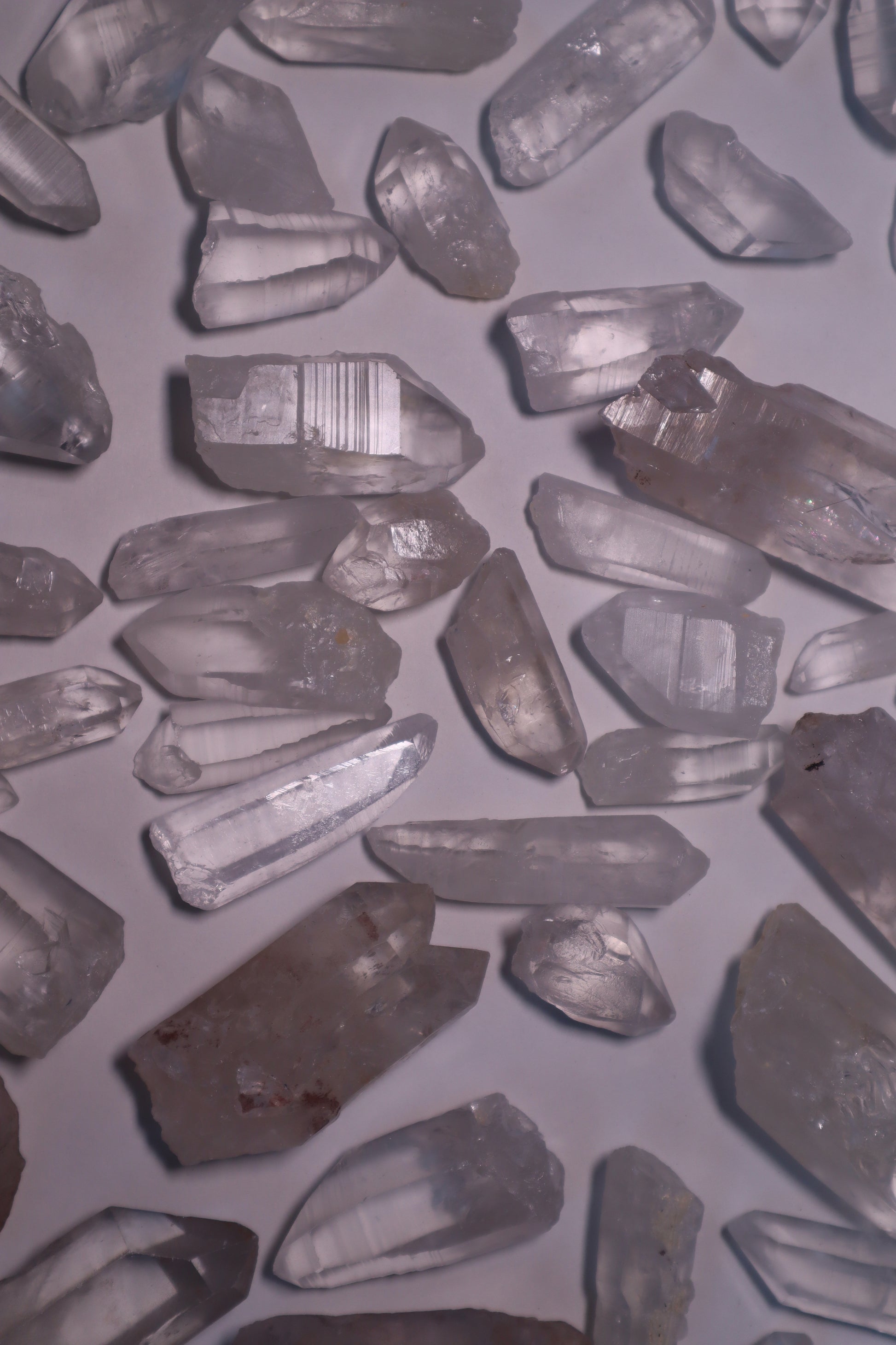 Clear Lemurian Quartz: Extraordinary formations known for their remarkable clarity and distinctive ladder-like striations.