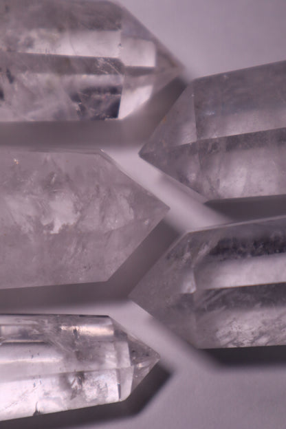 Clear Quartz: A universally revered and versatile crystal, is celebrated for its pure and transparent appearance. As a powerful amplifier of energy, Clear Quartz is believed to enhance intention-setting, manifestation, and the properties of other crystals.