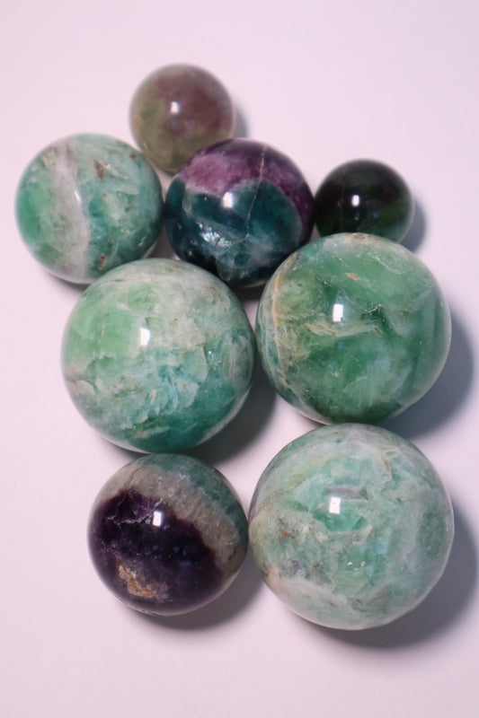 Fluorite: A captivating and multicolored crystal, is revered for its harmonizing properties that promote mental clarity, focus, and spiritual growth.