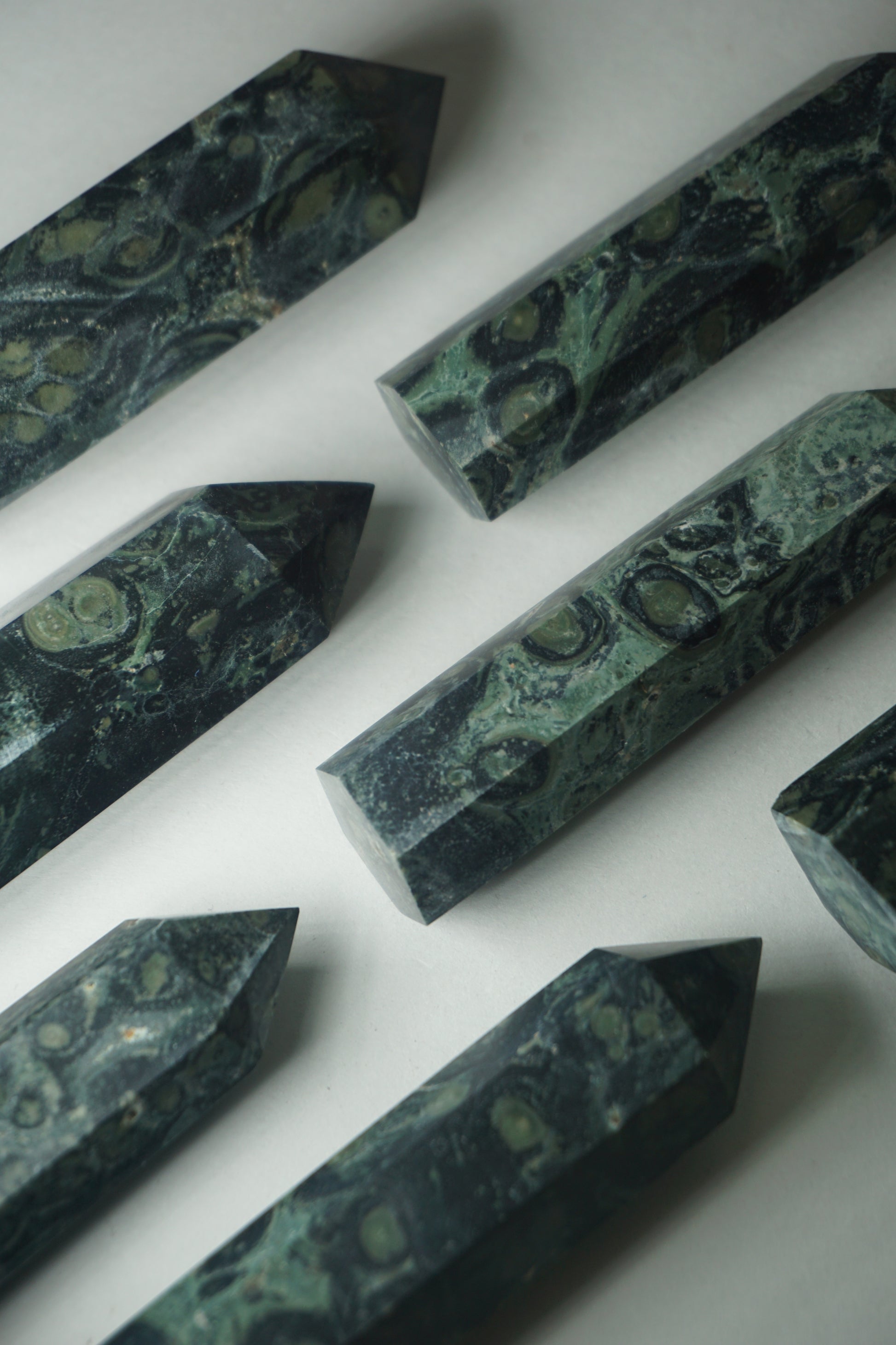 Kambaba Jasper: An intriguing and visually captivating crystal, is cherished for its deep green color and distinct swirling patterns reminiscent of lush landscapes.