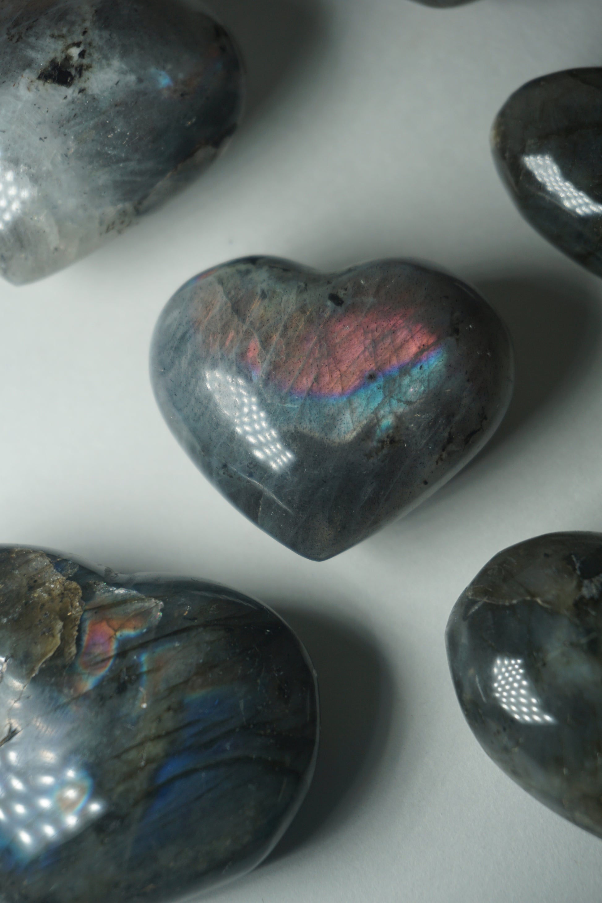 Labradorite: A mesmerizing and iridescent crystal known as the "Stone of Magic," captivates with its play of colors that shift and shimmer when viewed from different angles.