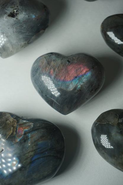 Labradorite: A mesmerizing and iridescent crystal known as the "Stone of Magic," captivates with its play of colors that shift and shimmer when viewed from different angles.