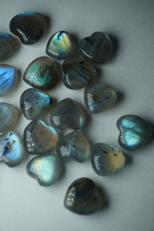 Labradorite: A mesmerizing and iridescent crystal known as the "Stone of Magic," captivates with its play of colors that shift and shimmer when viewed from different angles.