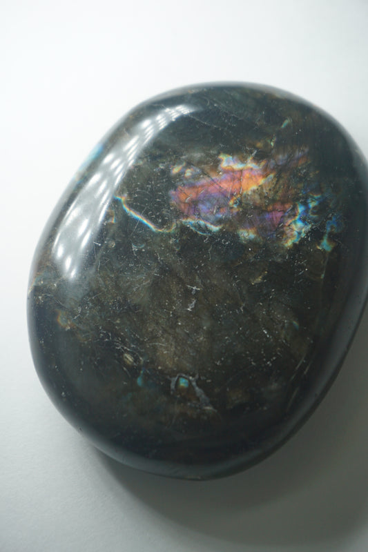 Labradorite: A mesmerizing and iridescent crystal known as the "Stone of Magic," captivates with its play of colors that shift and shimmer when viewed from different angles.