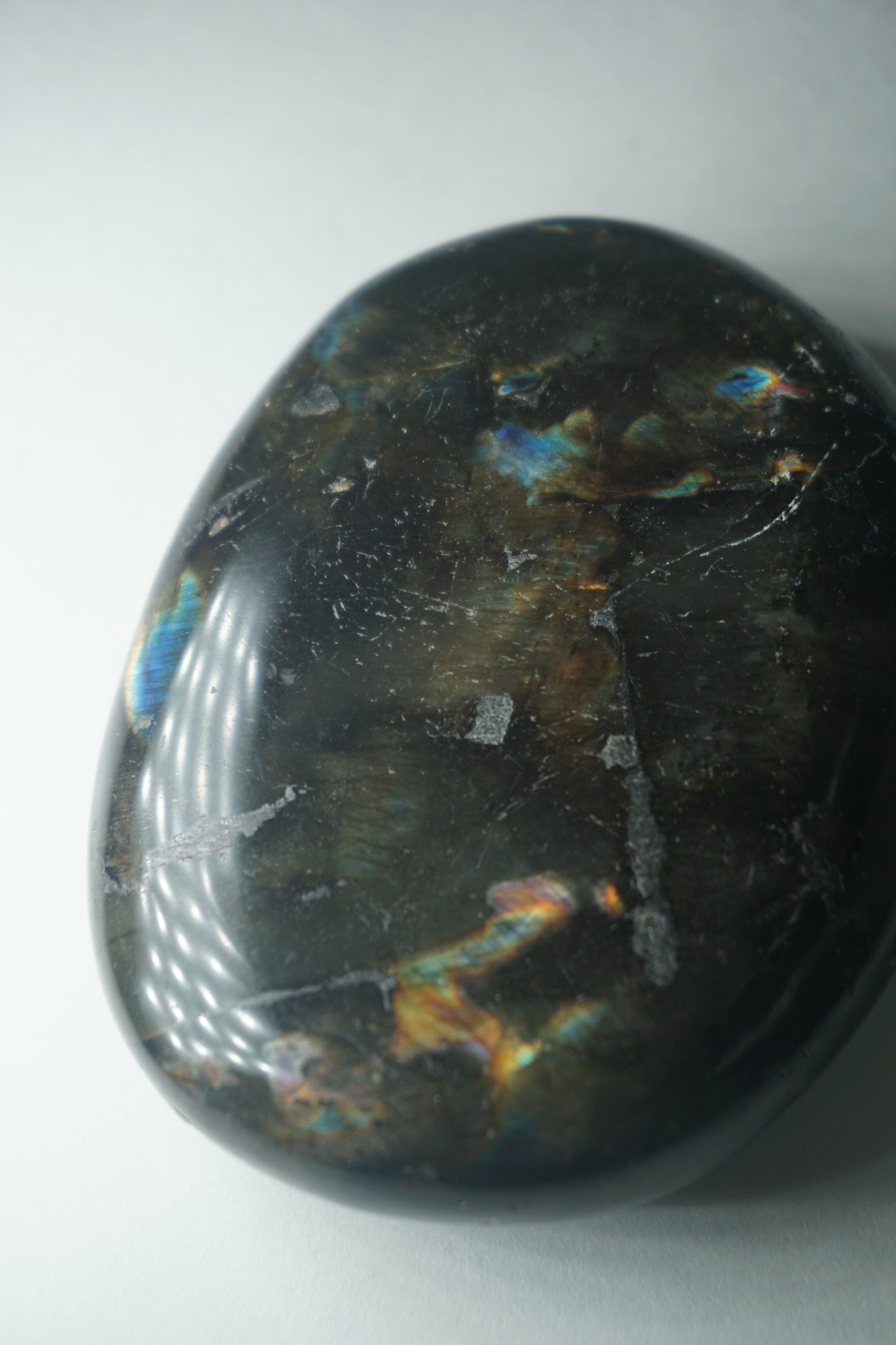 Labradorite: A mesmerizing and iridescent crystal known as the "Stone of Magic," captivates with its play of colors that shift and shimmer when viewed from different angles.