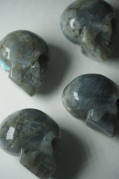 Labradorite: A mesmerizing and iridescent crystal known as the "Stone of Magic," captivates with its play of colors that shift and shimmer when viewed from different angles.