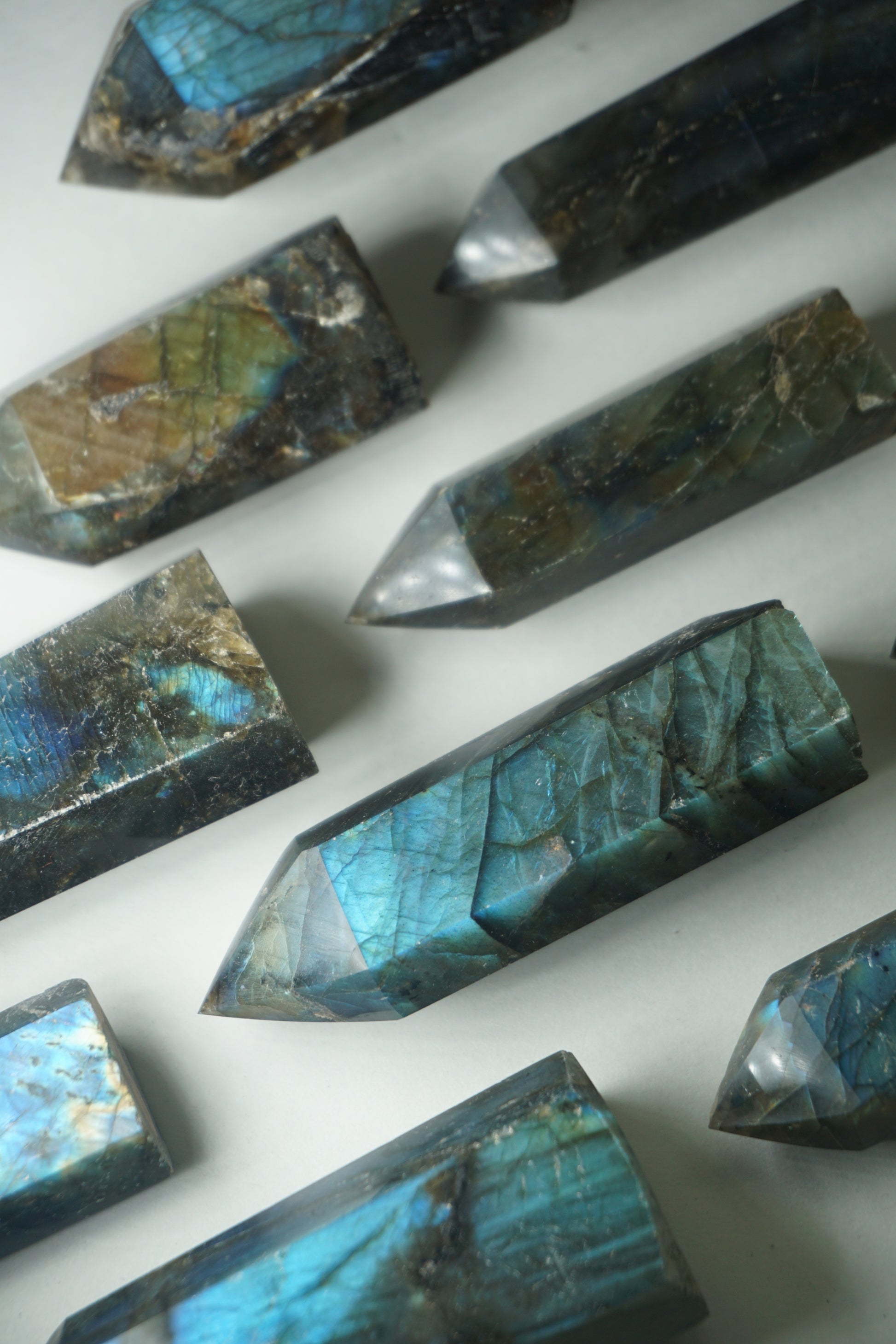 Labradorite: A mesmerizing and iridescent crystal known as the "Stone of Magic," captivates with its play of colors that shift and shimmer when viewed from different angles.