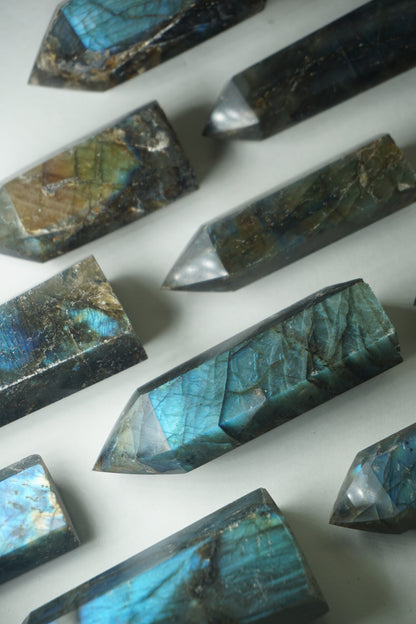 Labradorite: A mesmerizing and iridescent crystal known as the "Stone of Magic," captivates with its play of colors that shift and shimmer when viewed from different angles.