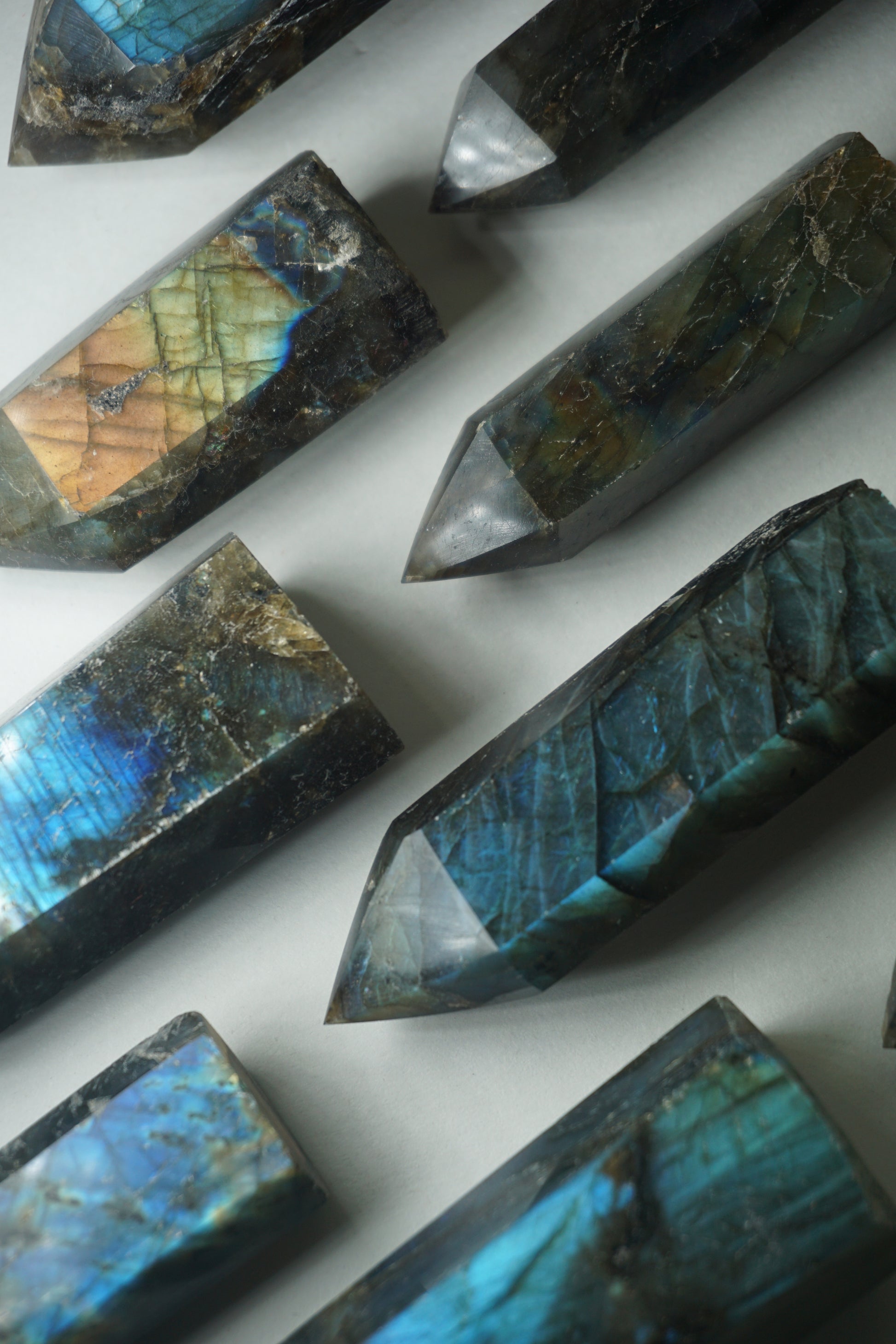 Labradorite: A mesmerizing and iridescent crystal known as the "Stone of Magic," captivates with its play of colors that shift and shimmer when viewed from different angles.