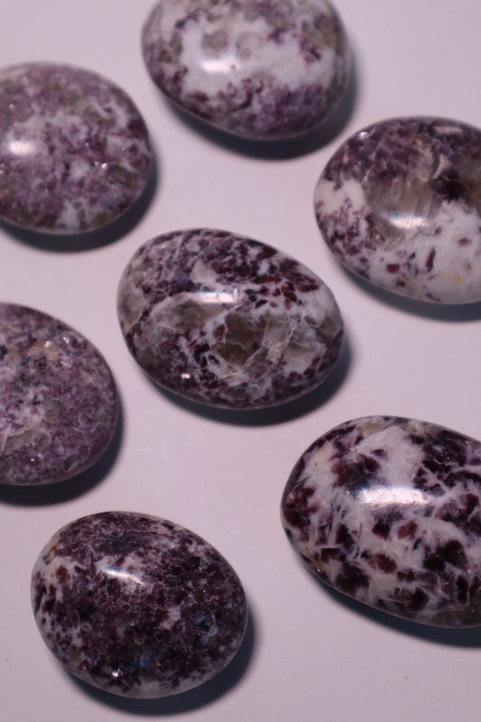 Lepidolite: A serene and calming crystal, is prized for its soft shades of purple and its potent connection to emotional healing and balance. With its association to the Heart, Third Eye, and Crown chakras, Lepidolite promotes inner peace, emotional release, and spiritual insight.