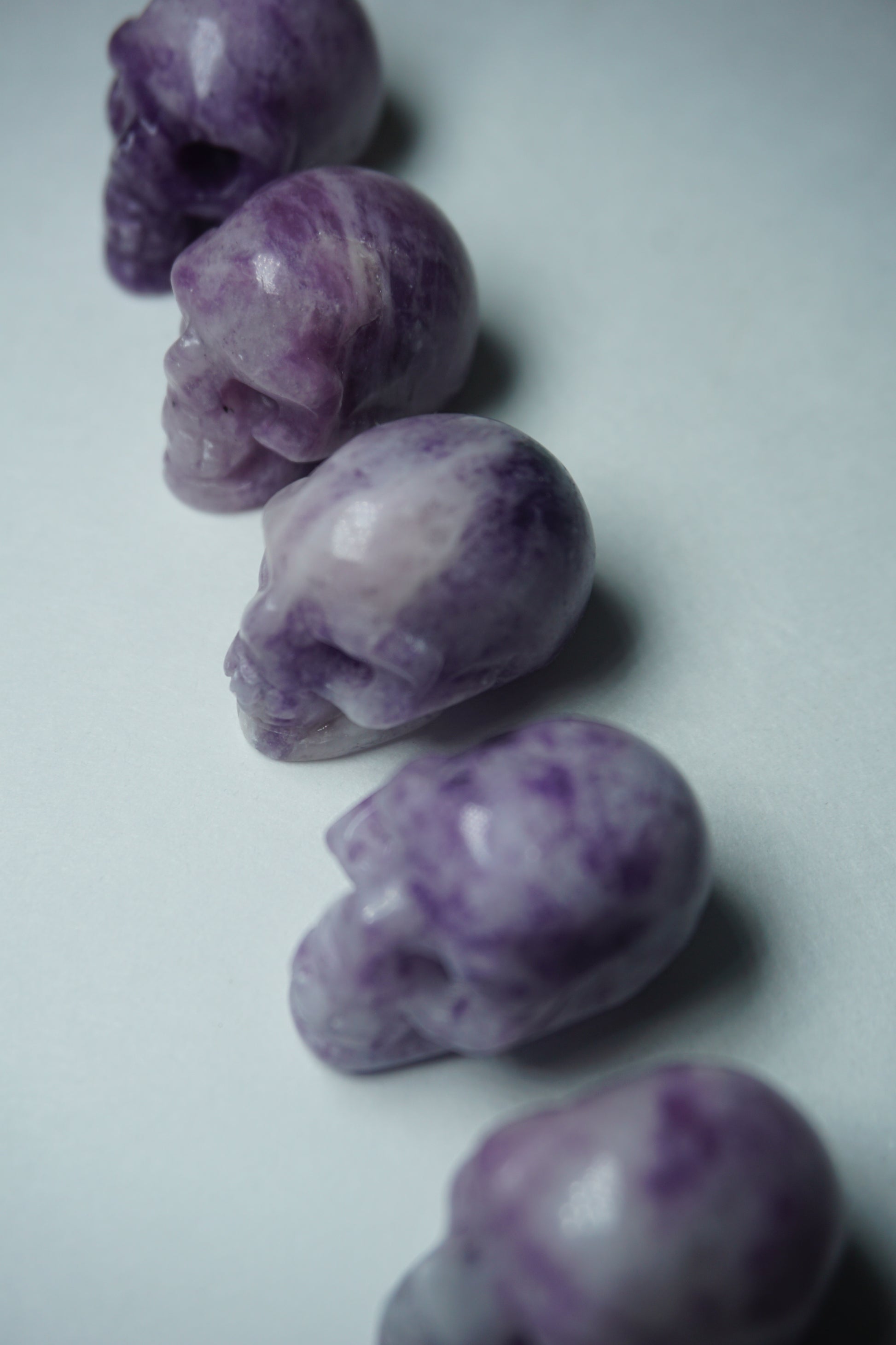 Lepidolite: A serene and calming crystal, is prized for its soft shades of purple and its potent connection to emotional healing and balance. With its association to the Heart, Third Eye, and Crown chakras, Lepidolite promotes inner peace, emotional release, and spiritual insight.