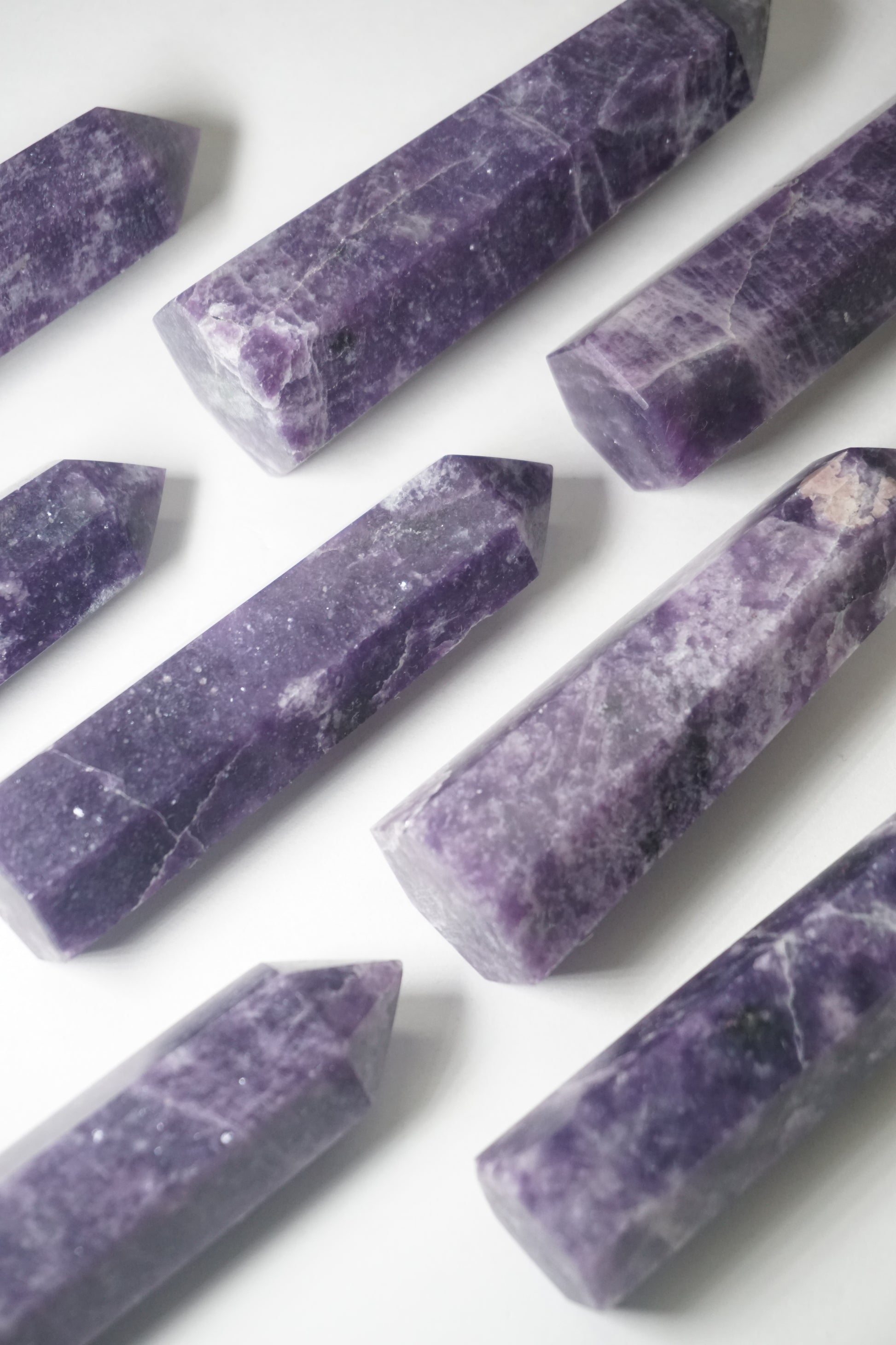 Lepidolite: A serene and calming crystal, is prized for its soft shades of purple and its potent connection to emotional healing and balance. With its association to the Heart, Third Eye, and Crown chakras, Lepidolite promotes inner peace, emotional release, and spiritual insight.