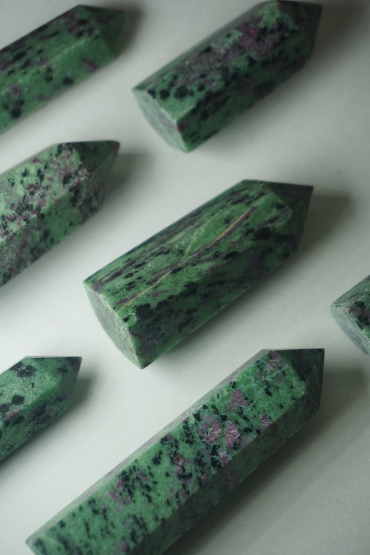 Ruby in Zoisite: Also known as Anyolite, is a captivating crystal that combines the vibrant energy of Ruby with the earthy tones of Zoisite. This unique blend creates a harmonious synergy that is believed to enhance passion, vitality, and spiritual growth.