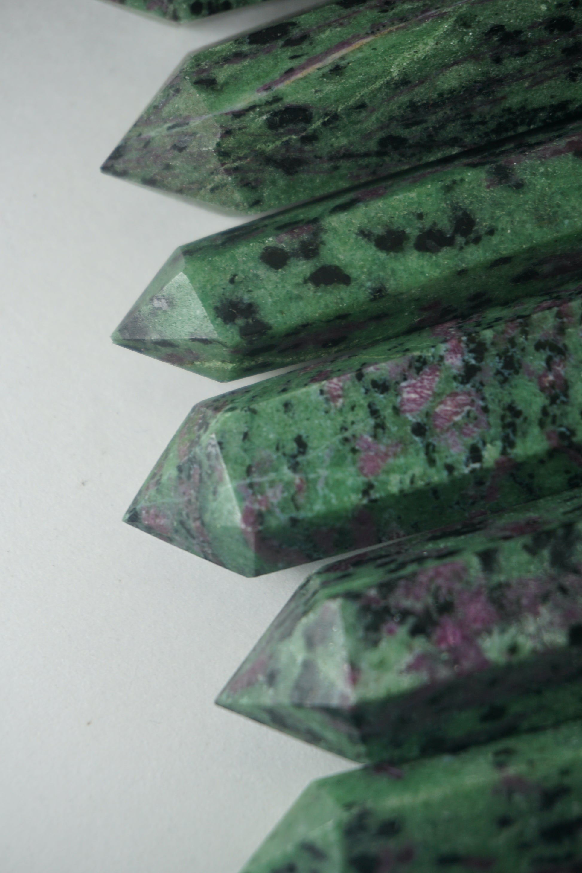 Ruby in Zoisite: Also known as Anyolite, is a captivating crystal that combines the vibrant energy of Ruby with the earthy tones of Zoisite. This unique blend creates a harmonious synergy that is believed to enhance passion, vitality, and spiritual growth.