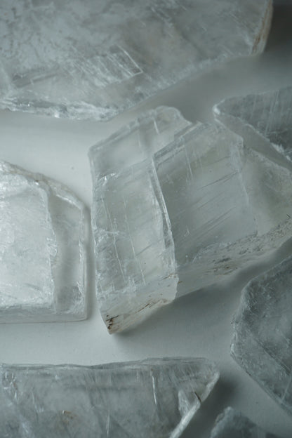 Selenite: A luminous and ethereal crystal, is revered for its radiant white appearance and its potent connection to higher realms. With its association to the Crown chakra, Selenite is believed to enhance spiritual awareness, communication with angels, and deep meditation.