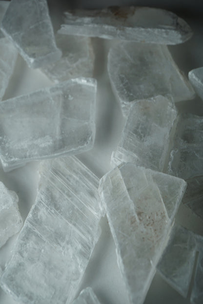 Selenite: A luminous and ethereal crystal, is revered for its radiant white appearance and its potent connection to higher realms. With its association to the Crown chakra, Selenite is believed to enhance spiritual awareness, communication with angels, and deep meditation.