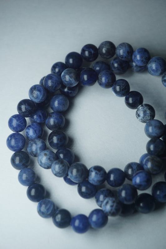 Sodalite: A captivating deep blue crystal mottled with white veins, is esteemed for its harmonizing properties that bridge the gap between logic and intuition. With its serene and calming energy, Sodalite is believed to enhance mental clarity, promoting rational thought and aiding in effective communication.