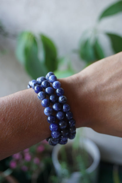 Sodalite: A captivating deep blue crystal mottled with white veins, is esteemed for its harmonizing properties that bridge the gap between logic and intuition. With its serene and calming energy, Sodalite is believed to enhance mental clarity, promoting rational thought and aiding in effective communication.
