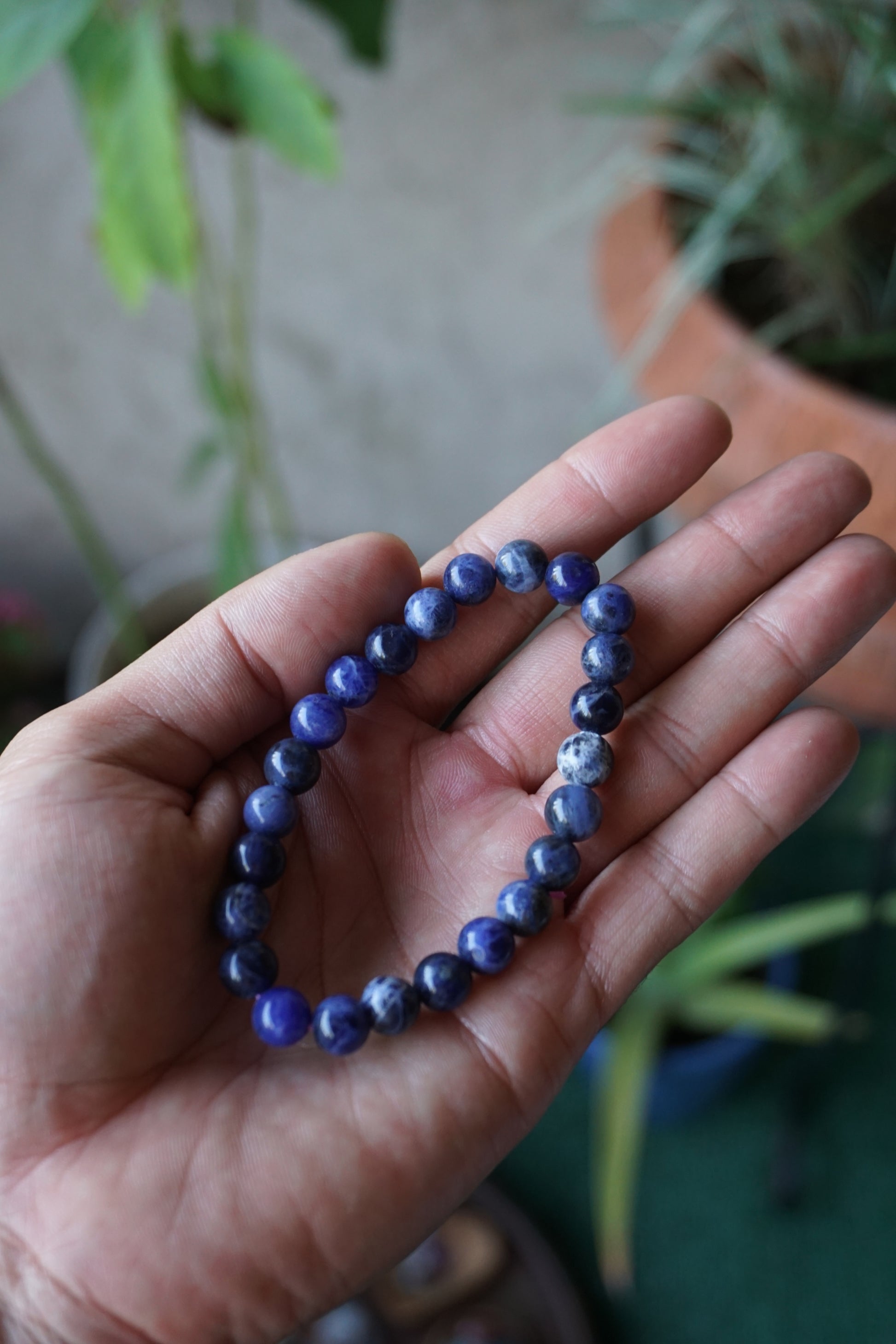 Sodalite: A captivating deep blue crystal mottled with white veins, is esteemed for its harmonizing properties that bridge the gap between logic and intuition. With its serene and calming energy, Sodalite is believed to enhance mental clarity, promoting rational thought and aiding in effective communication.
