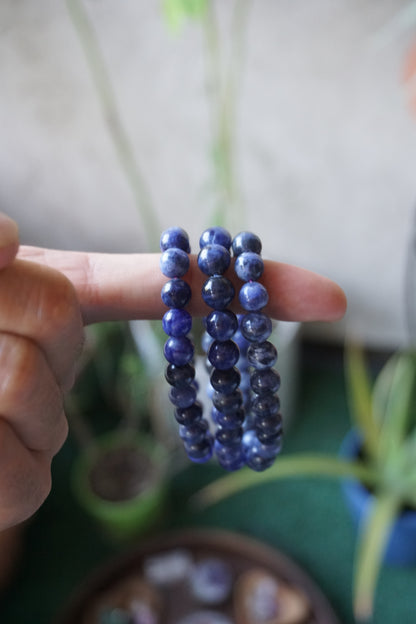 Sodalite: A captivating deep blue crystal mottled with white veins, is esteemed for its harmonizing properties that bridge the gap between logic and intuition. With its serene and calming energy, Sodalite is believed to enhance mental clarity, promoting rational thought and aiding in effective communication.